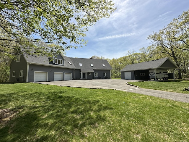 28 Drewbarrie Ln, Easton, CT 06612 - view of front of property featuring a front yard, an outdoor structure, and driveway