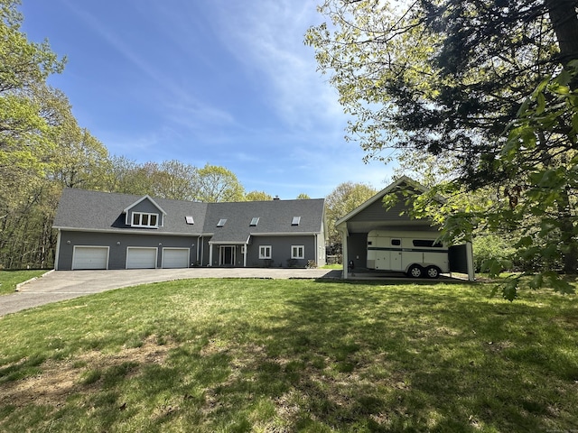 view of front of home featuring a garage, a front yard, and concrete driveway