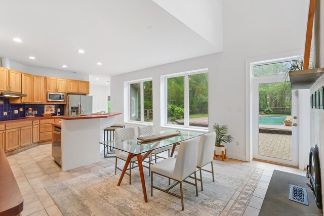 28 Drewbarrie Ln, Easton, CT 06612 - dining space featuring baseboards, recessed lighting, light tile patterned flooring, and plenty of natural light