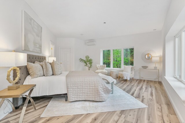 28 Drewbarrie Ln, Easton, CT 06612 - bedroom featuring light wood-style flooring and an AC wall unit