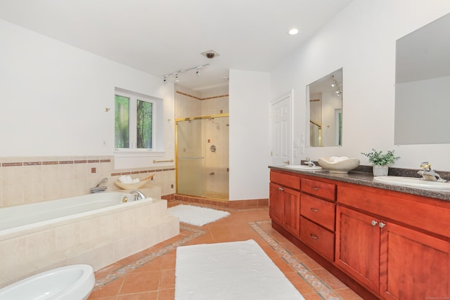 28 Drewbarrie Ln, Easton, CT 06612 - full bathroom featuring a garden tub, tile patterned flooring, a shower stall, and a sink