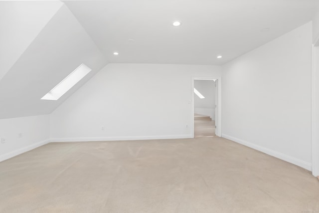 28 Drewbarrie Ln, Easton, CT 06612 - additional living space featuring baseboards, light carpet, lofted ceiling with skylight, and recessed lighting