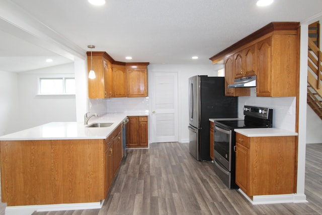 340 Robbins Ave, Newington, CT 06111 - kitchen with under cabinet range hood, brown cabinets, a sink, dark wood finished floors, and stainless steel appliances
