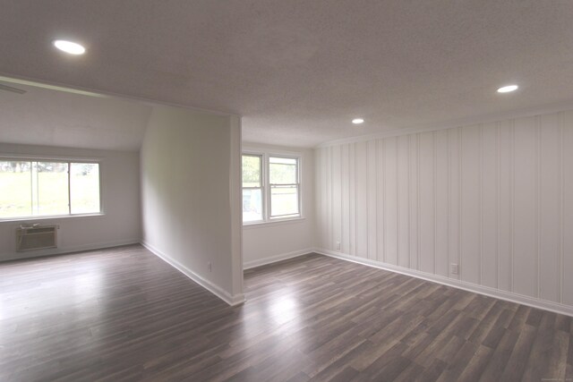 340 Robbins Ave, Newington, CT 06111 - spare room featuring dark wood-style flooring, baseboards, recessed lighting, and a wall unit AC