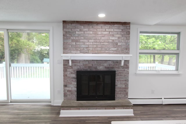 340 Robbins Ave, Newington, CT 06111 - details with a baseboard radiator, a fireplace, recessed lighting, and wood finished floors