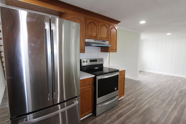 340 Robbins Ave, Newington, CT 06111 - kitchen featuring brown cabinets, appliances with stainless steel finishes, light countertops, baseboards, and under cabinet range hood