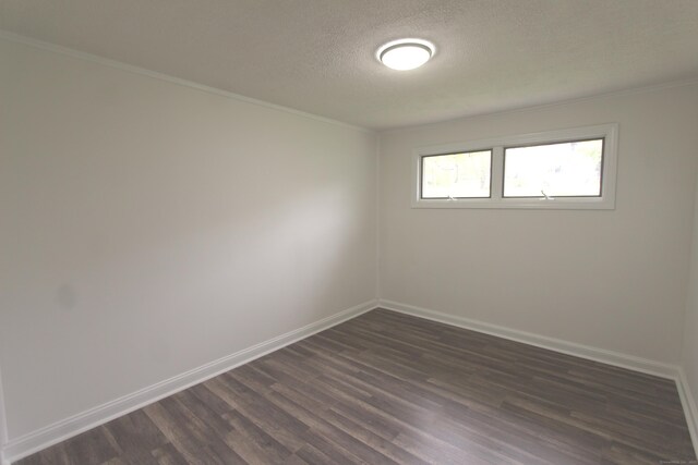 340 Robbins Ave, Newington, CT 06111 - empty room with crown molding, baseboards, dark wood-style flooring, and a textured ceiling