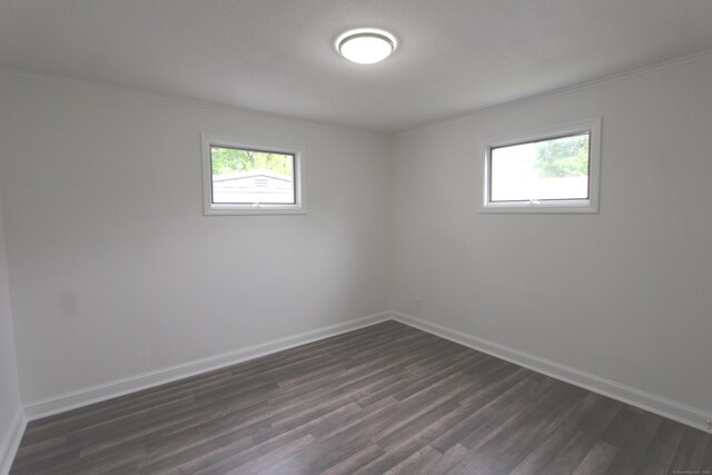 340 Robbins Ave, Newington, CT 06111 - empty room featuring crown molding, baseboards, and dark wood finished floors