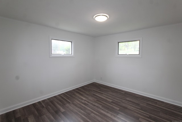340 Robbins Ave, Newington, CT 06111 - unfurnished room featuring crown molding, baseboards, plenty of natural light, and dark wood finished floors