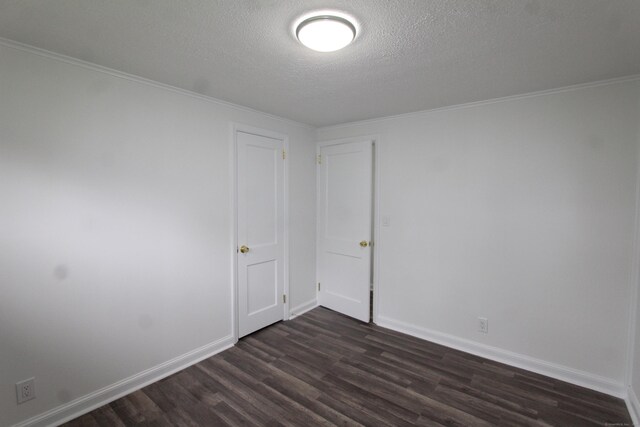340 Robbins Ave, Newington, CT 06111 - spare room featuring crown molding, a textured ceiling, baseboards, and dark wood-type flooring