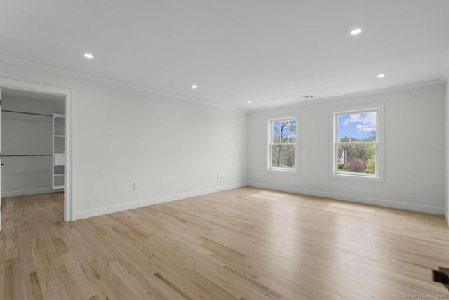 interior space with recessed lighting, baseboards, ornamental molding, and light wood finished floors