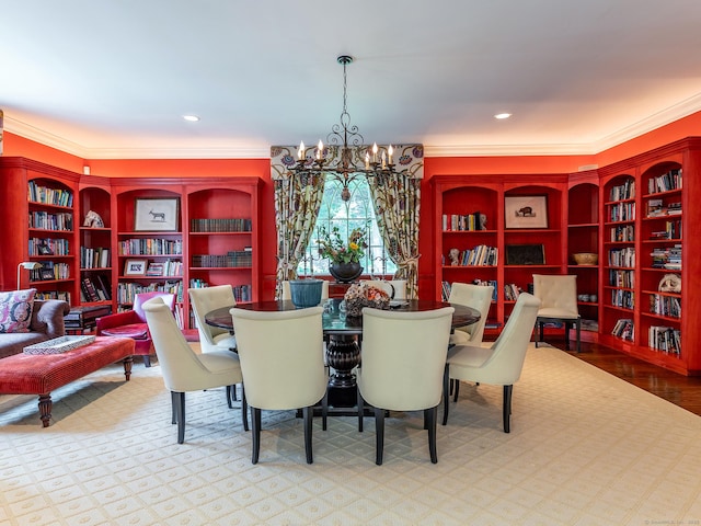 dining area with crown molding, a chandelier, and built in shelves