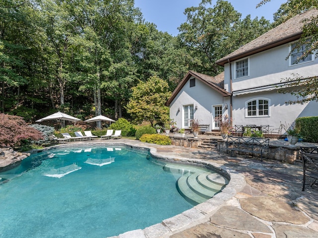 swimming pool with a patio area