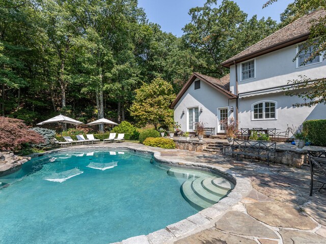 outdoor pool with a patio