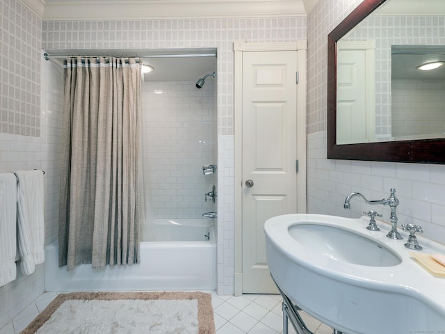 full bath with ornamental molding, shower / bath combo with shower curtain, and tile patterned flooring
