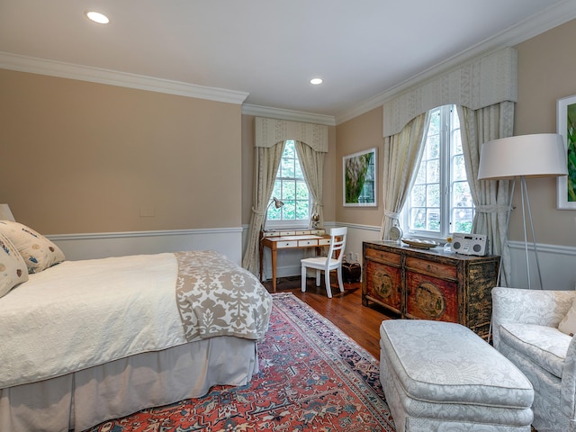bedroom with crown molding, wood finished floors, and recessed lighting