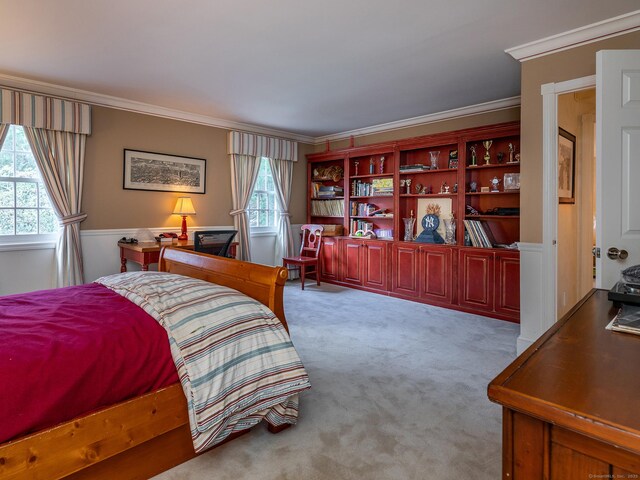 bedroom with carpet flooring and crown molding