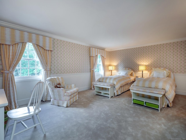 bedroom featuring wallpapered walls, ornamental molding, multiple windows, carpet floors, and wainscoting