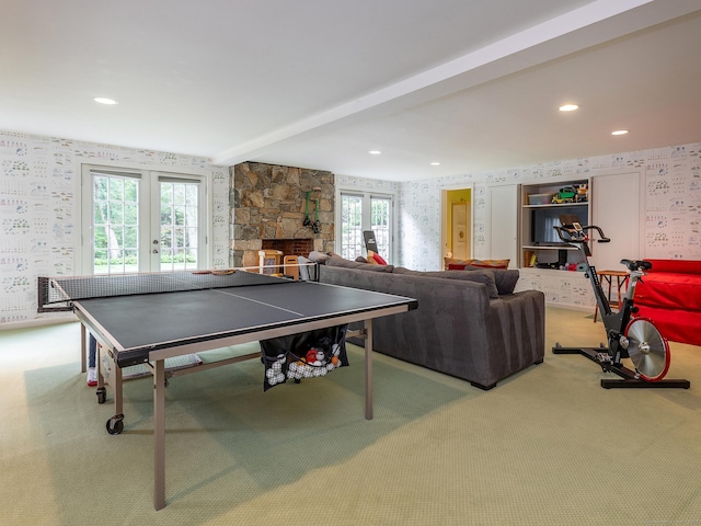 recreation room featuring wallpapered walls, french doors, carpet flooring, beamed ceiling, and recessed lighting