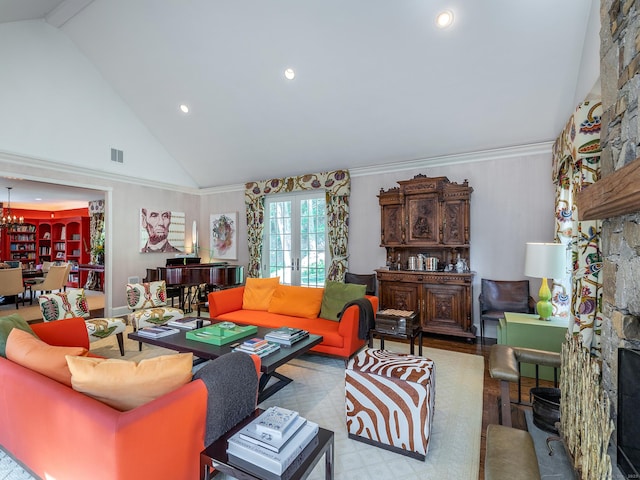 living room featuring high vaulted ceiling, recessed lighting, a fireplace, and a chandelier