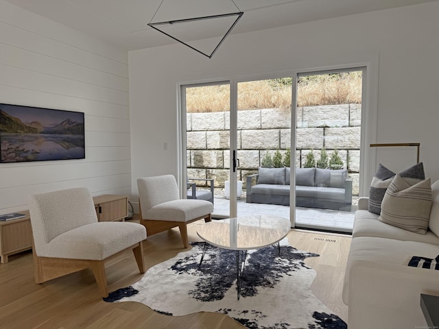 785 Post Rd E Unit 303, Westport, CT 06880 - living room featuring wood finished floors and wood walls