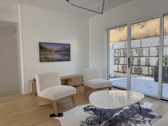 785 Post Rd E Unit 303, Westport, CT 06880 - living area with light wood-style floors and wooden walls