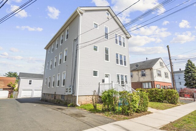 279 Oak St, New Britain, CT 06051 - view of home's exterior with a detached garage