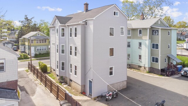 279 Oak St, New Britain, CT 06051 - view of side of home with fence and a residential view