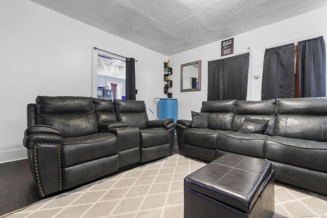 279 Oak St, New Britain, CT 06051 - living room with baseboards and a textured ceiling