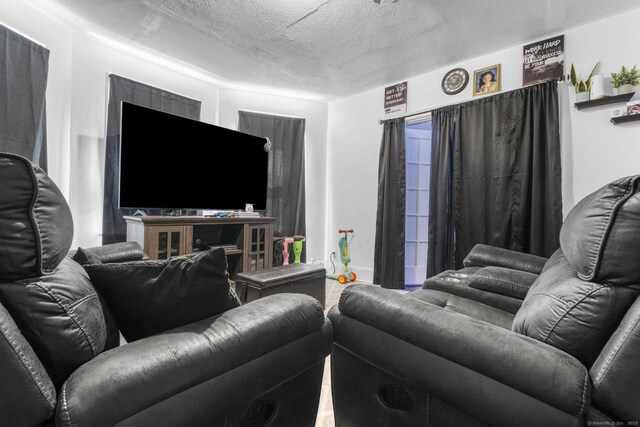 279 Oak St, New Britain, CT 06051 - living area with a textured ceiling