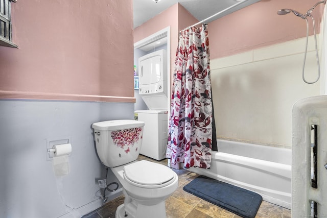 279 Oak St, New Britain, CT 06051 - bathroom with shower / bath combo with shower curtain, stacked washer / drying machine, and toilet