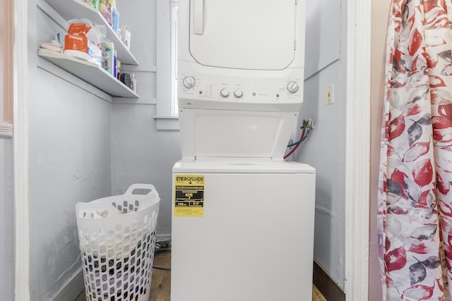 279 Oak St, New Britain, CT 06051 - clothes washing area featuring laundry area, wood finished floors, and stacked washer and clothes dryer