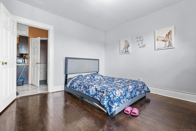 279 Oak St, New Britain, CT 06051 - bedroom featuring baseboards and hardwood / wood-style flooring