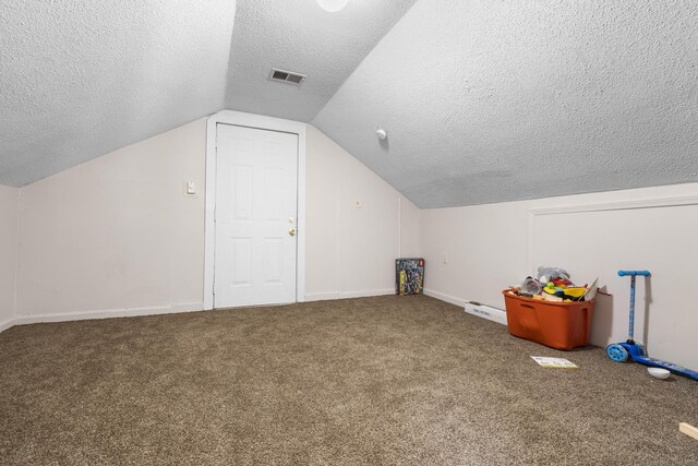 279 Oak St, New Britain, CT 06051 - bonus room featuring carpet floors, vaulted ceiling, a textured ceiling, and visible vents
