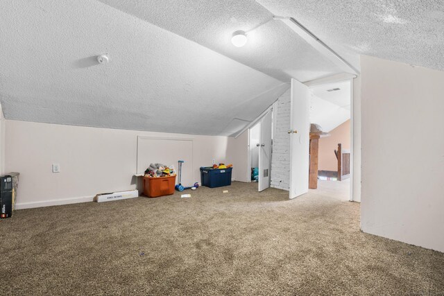 279 Oak St, New Britain, CT 06051 - bonus room featuring carpet flooring, a textured ceiling, and lofted ceiling