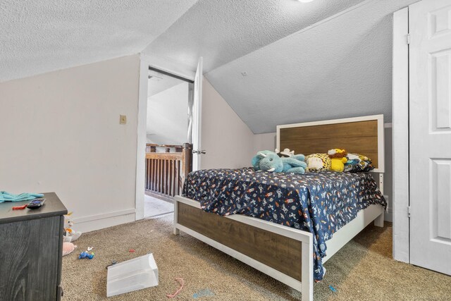 279 Oak St, New Britain, CT 06051 - bedroom featuring carpet floors, vaulted ceiling, and a textured ceiling