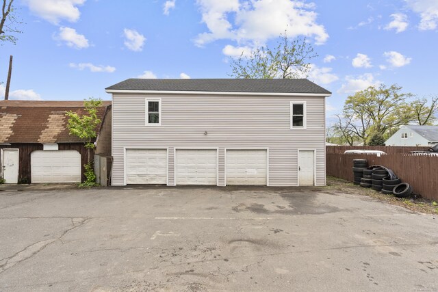 279 Oak St, New Britain, CT 06051 - garage with fence and aphalt driveway