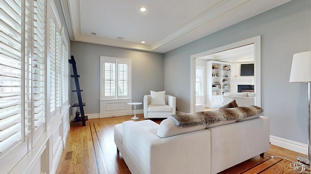 27 Dock Rd, Milford, CT 06460 - living area featuring visible vents, crown molding, a fireplace, light wood finished floors, and recessed lighting