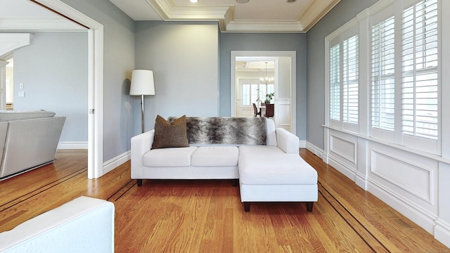 27 Dock Rd, Milford, CT 06460 - living area with crown molding, baseboards, wood finished floors, and a notable chandelier