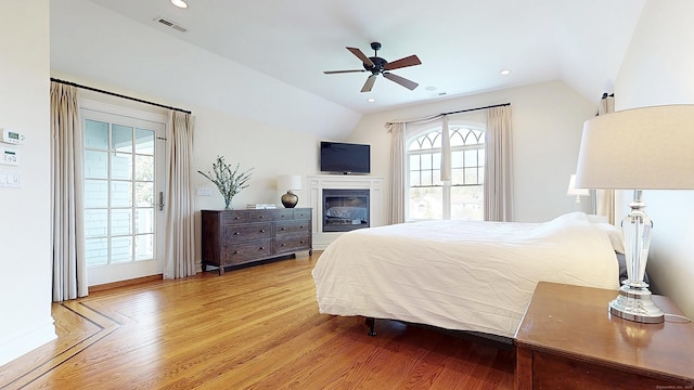 27 Dock Rd, Milford, CT 06460 - bedroom with access to exterior, vaulted ceiling, wood finished floors, and visible vents