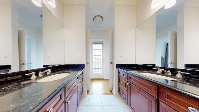 27 Dock Rd, Milford, CT 06460 - bathroom with crown molding, tile patterned floors, two vanities, and a sink