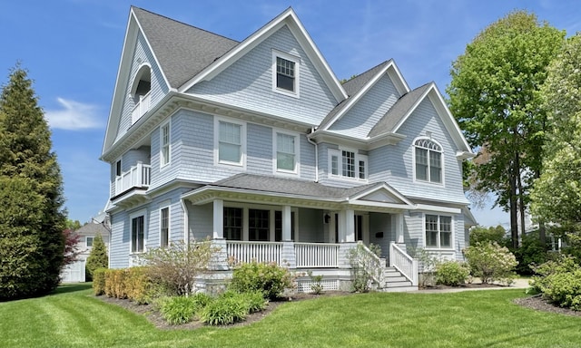 27 Dock Rd, Milford, CT 06460 - victorian home with roof with shingles, a porch, and a front lawn