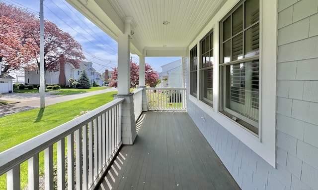 27 Dock Rd, Milford, CT 06460 - wooden deck with covered porch and a lawn