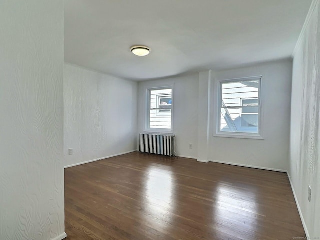 141 Arcadia Ave, Bridgeport, CT 06604 - spare room featuring radiator, baseboards, and wood finished floors