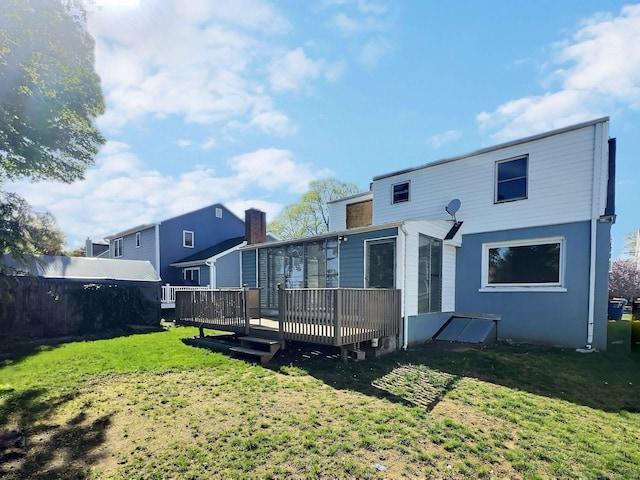 141 Arcadia Ave, Bridgeport, CT 06604 - rear view of house featuring a lawn, a wooden deck, and fence