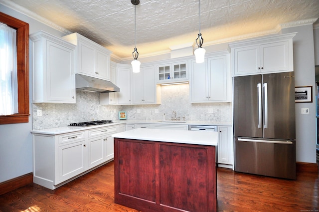 1123 Windsor Ave, Windsor, CT 06095 - kitchen with stainless steel appliances, under cabinet range hood, a sink, light countertops, and dark wood-type flooring