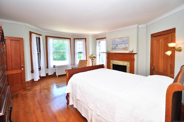 1123 Windsor Ave, Windsor, CT 06095 - bedroom with radiator, wood finished floors, crown molding, and baseboards
