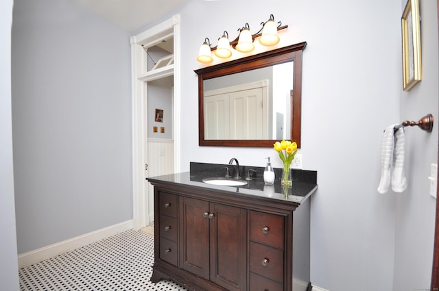 1123 Windsor Ave, Windsor, CT 06095 - bathroom with baseboards, vanity, and tile patterned floors