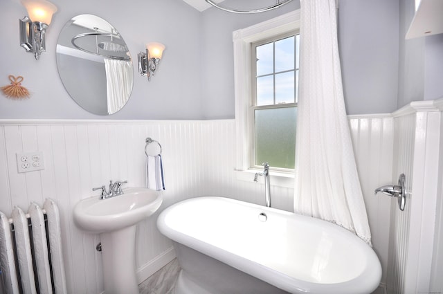 1123 Windsor Ave, Windsor, CT 06095 - full bathroom with a wainscoted wall, a freestanding tub, radiator heating unit, and a sink