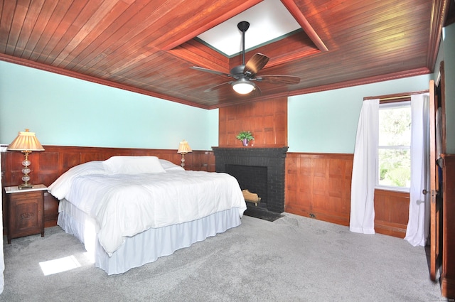 1123 Windsor Ave, Windsor, CT 06095 - carpeted bedroom with wooden ceiling, wainscoting, wooden walls, ornamental molding, and a brick fireplace